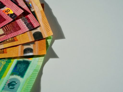 a pile of money sitting on top of a table