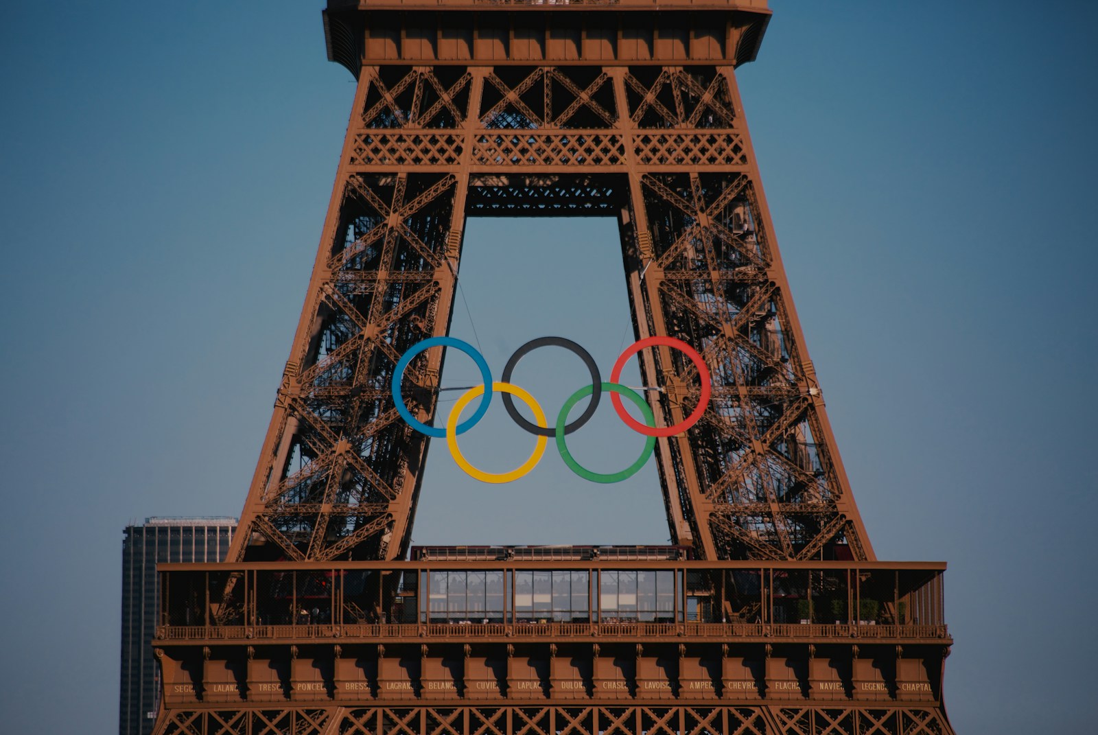 The eiffel tower with the olympic rings in front of it