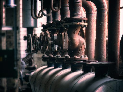 grayscale photo of metal pipe